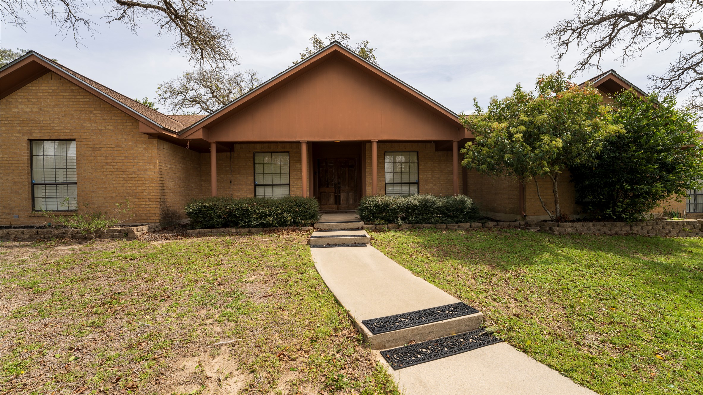 2105 Yokley Road Rockdale, TX 76567 - Photo 37 of 38 a front view of house with yard and trees in the background