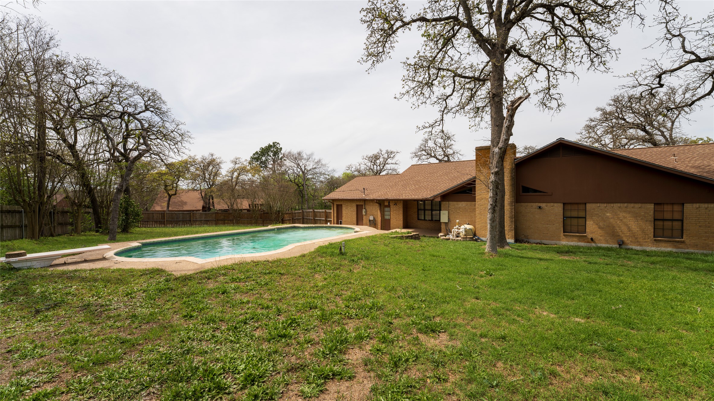 2105 Yokley Road Rockdale, TX 76567 - Photo 5 of 38 a view of a house with a big yard and large trees