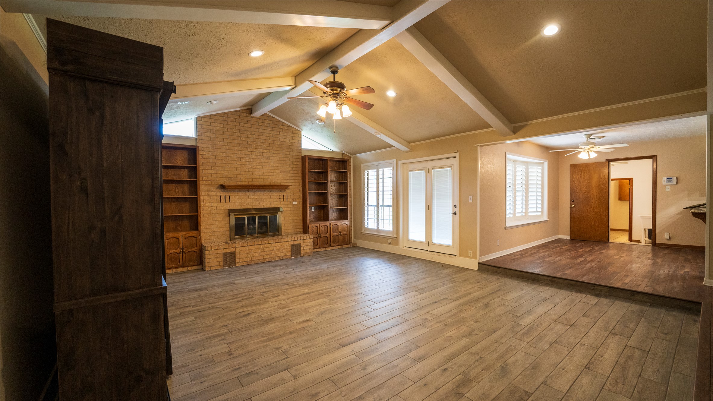 2105 Yokley Road Rockdale, TX 76567 - Photo 8 of 38 a view of empty room with wooden floor and fireplace