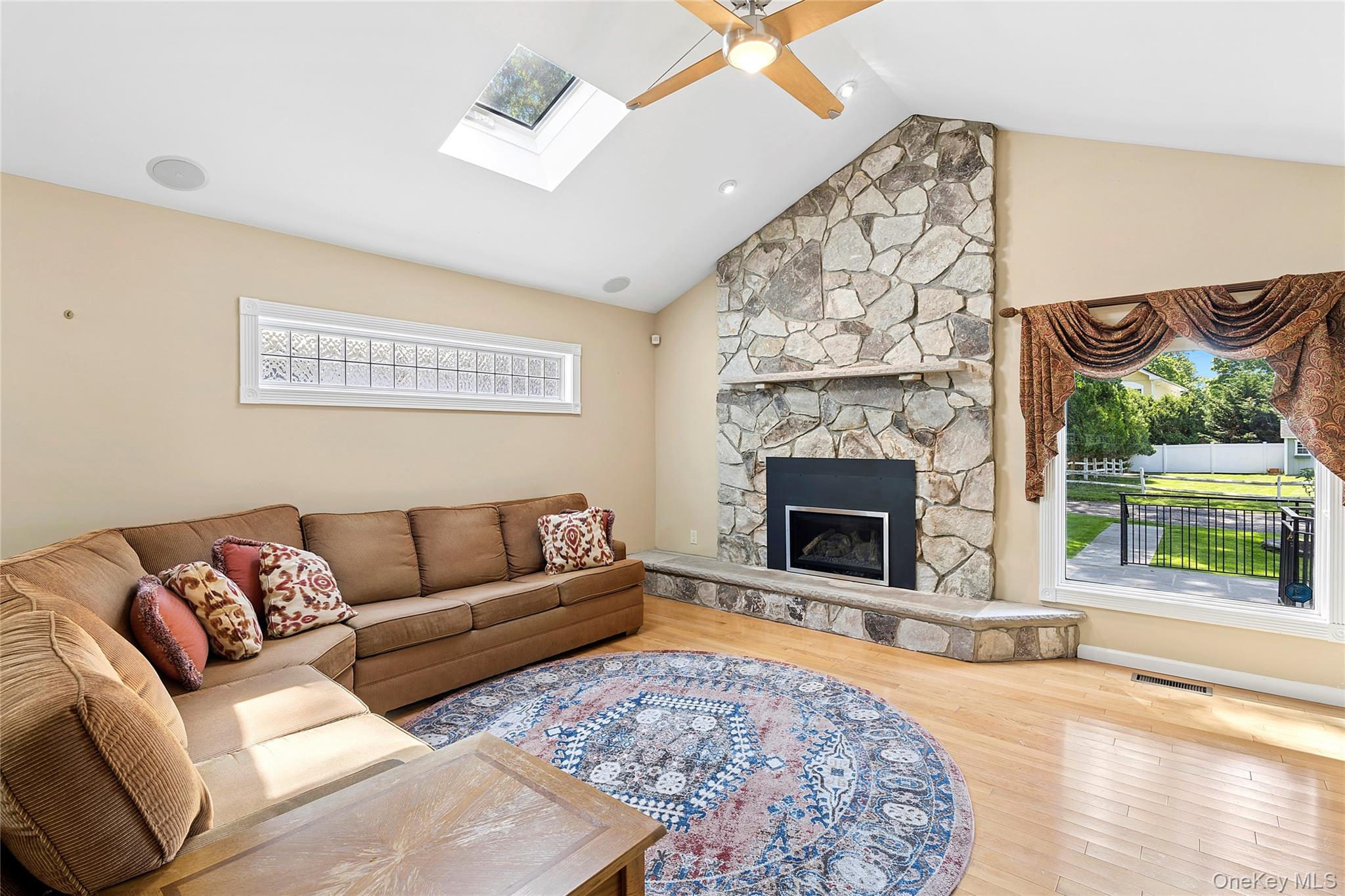 54 Breezy Point Road Wading River, NY 11792 - Photo 3 of 17 Family room with gas fireplace