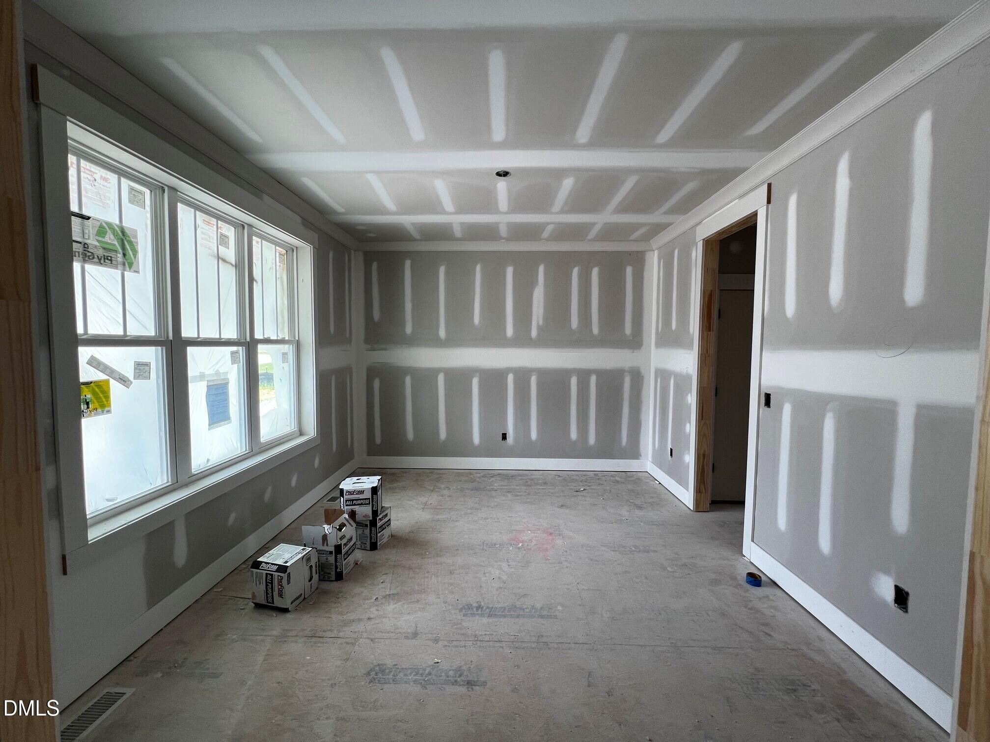 6051 Scalybark Road Durham, NC 27712 - Photo 4 of 53 an empty room with windows