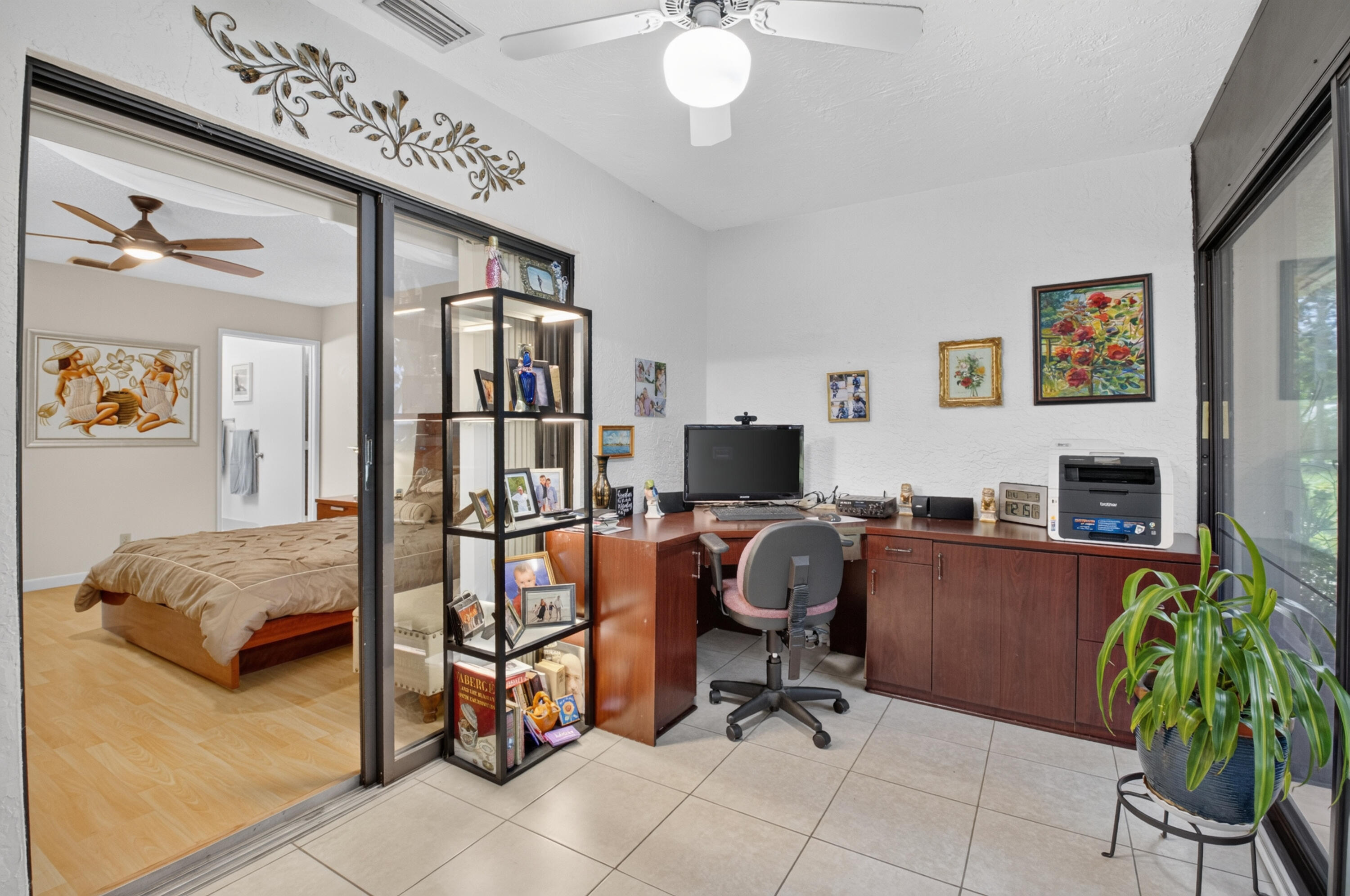 8246 Springview Terrace Boca Raton, FL 33496 - Photo 30 of 53 a view of a livingroom with workspace and a couch