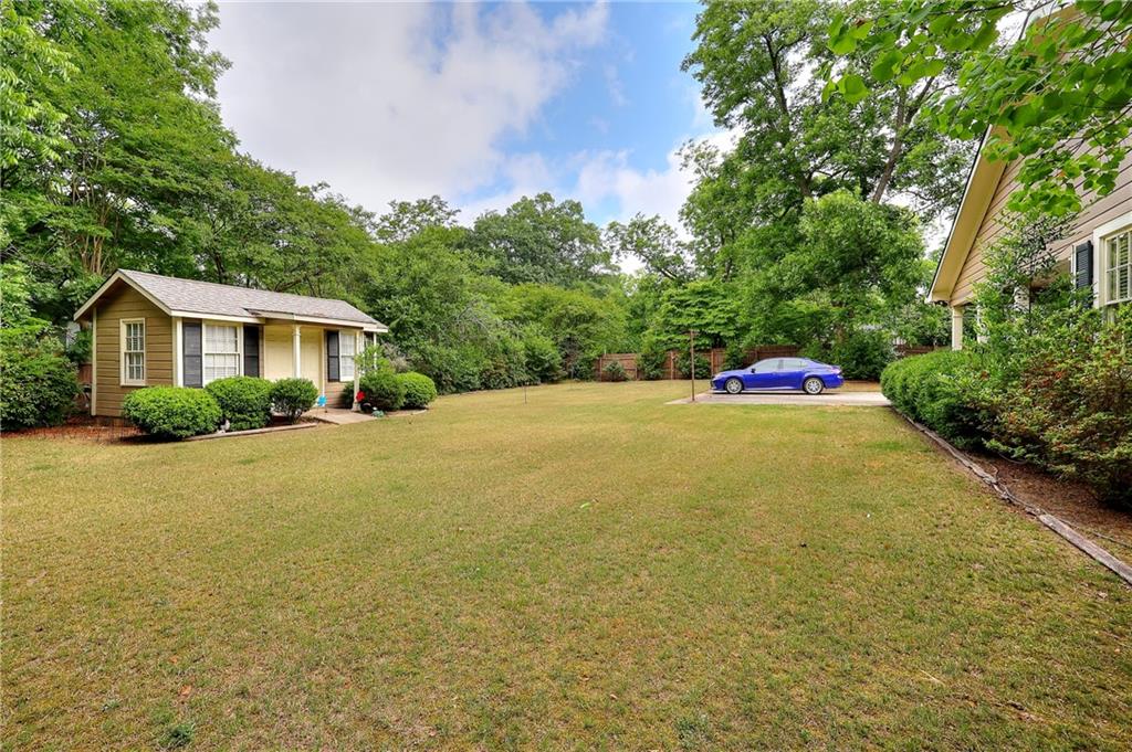 317 North Cherokee Road Social Circle, GA 30025 - Photo 7 of 32 a front view of a house with yard and trees