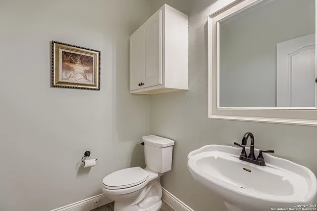 a bathroom with a toilet and a sink