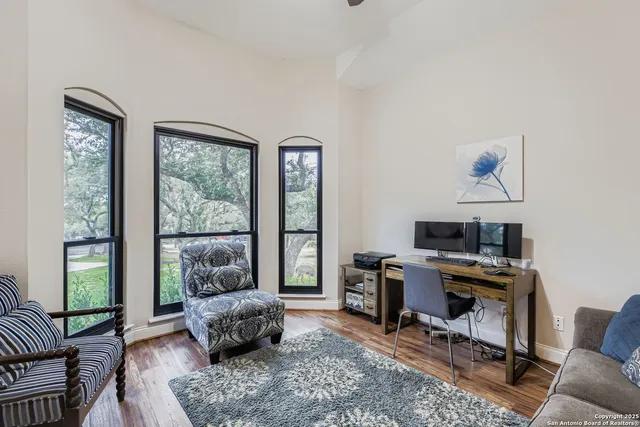 a living room with furniture and a window