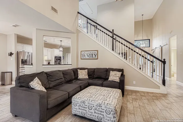 a living room with furniture and a rug