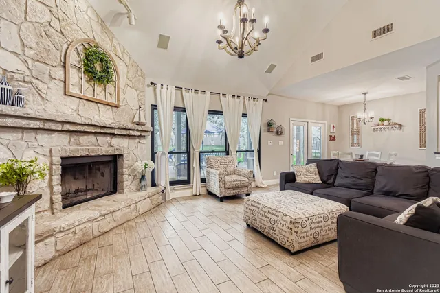 a living room with furniture and a fireplace