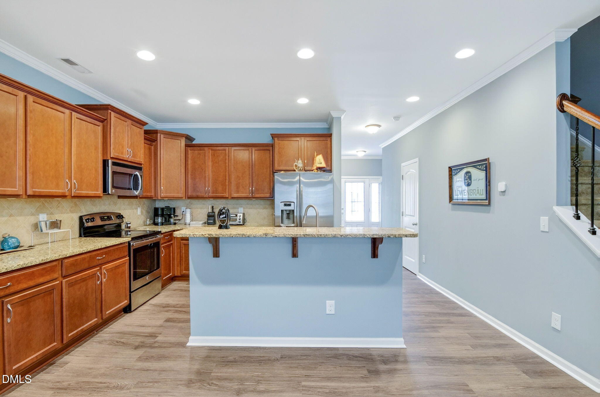 14310 Foxcroft Road Raleigh, NC 27614 - Photo 11 of 32 a kitchen with stainless steel appliances granite countertop a sink a stove a refrigerator cabinets and a window