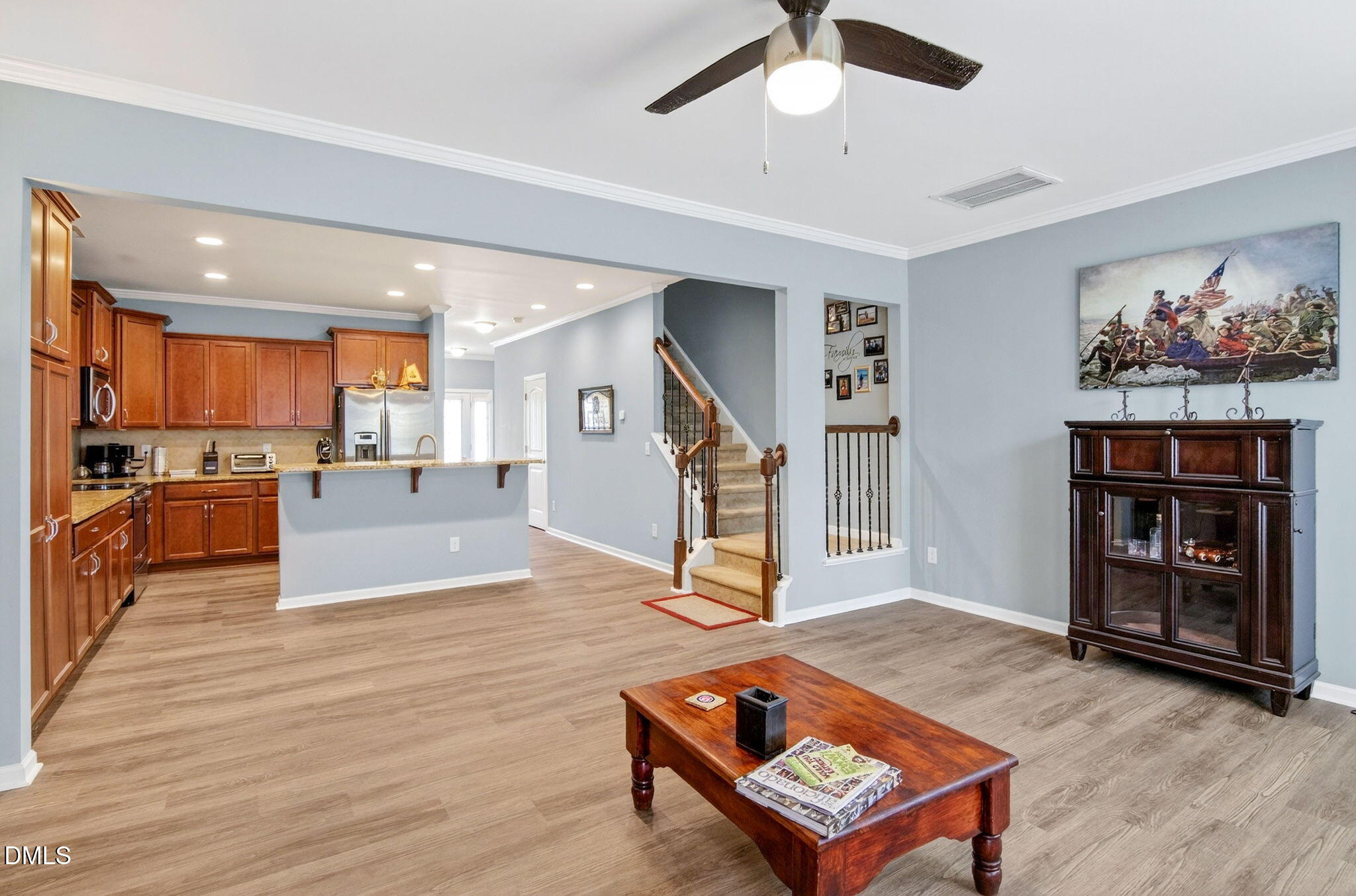 14310 Foxcroft Road Raleigh, NC 27614 - Photo 14 of 32 a living room with furniture a dining table and kitchen view