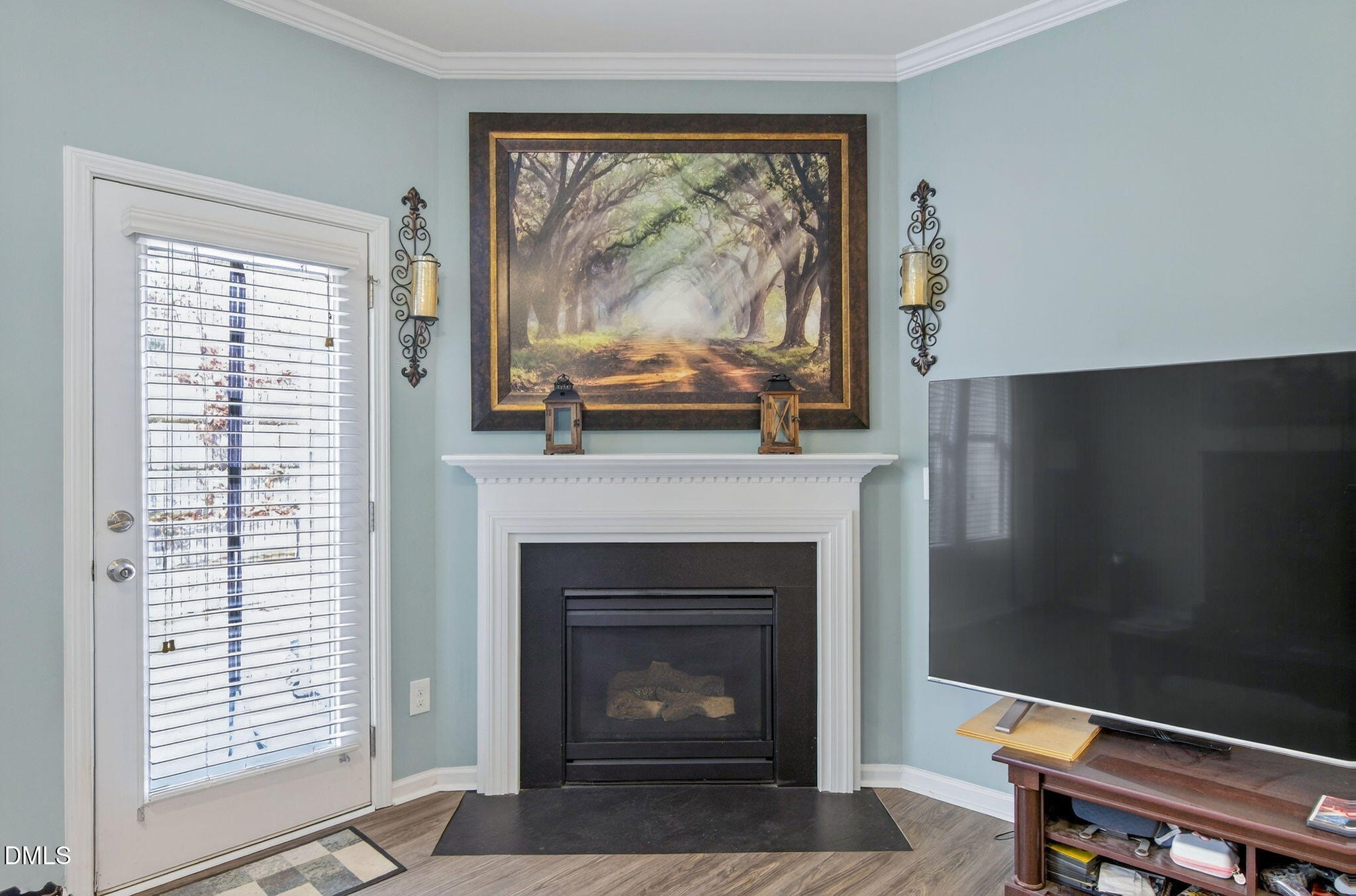 14310 Foxcroft Road Raleigh, NC 27614 - Photo 16 of 32 a living room with a fireplace and a window