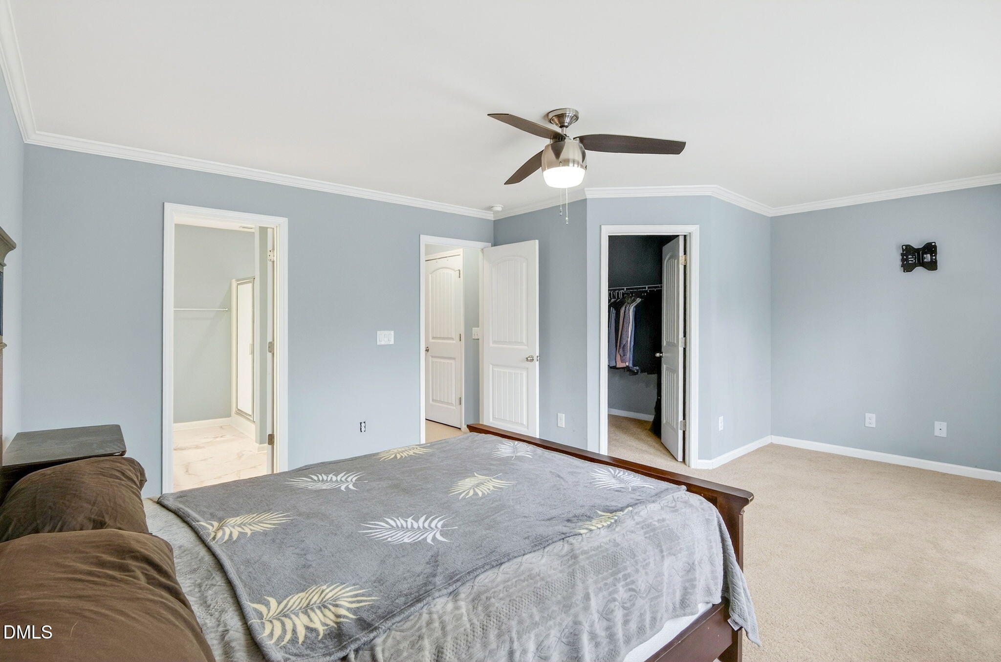 14310 Foxcroft Road Raleigh, NC 27614 - Photo 20 of 32 a bedroom with a large bed and closet