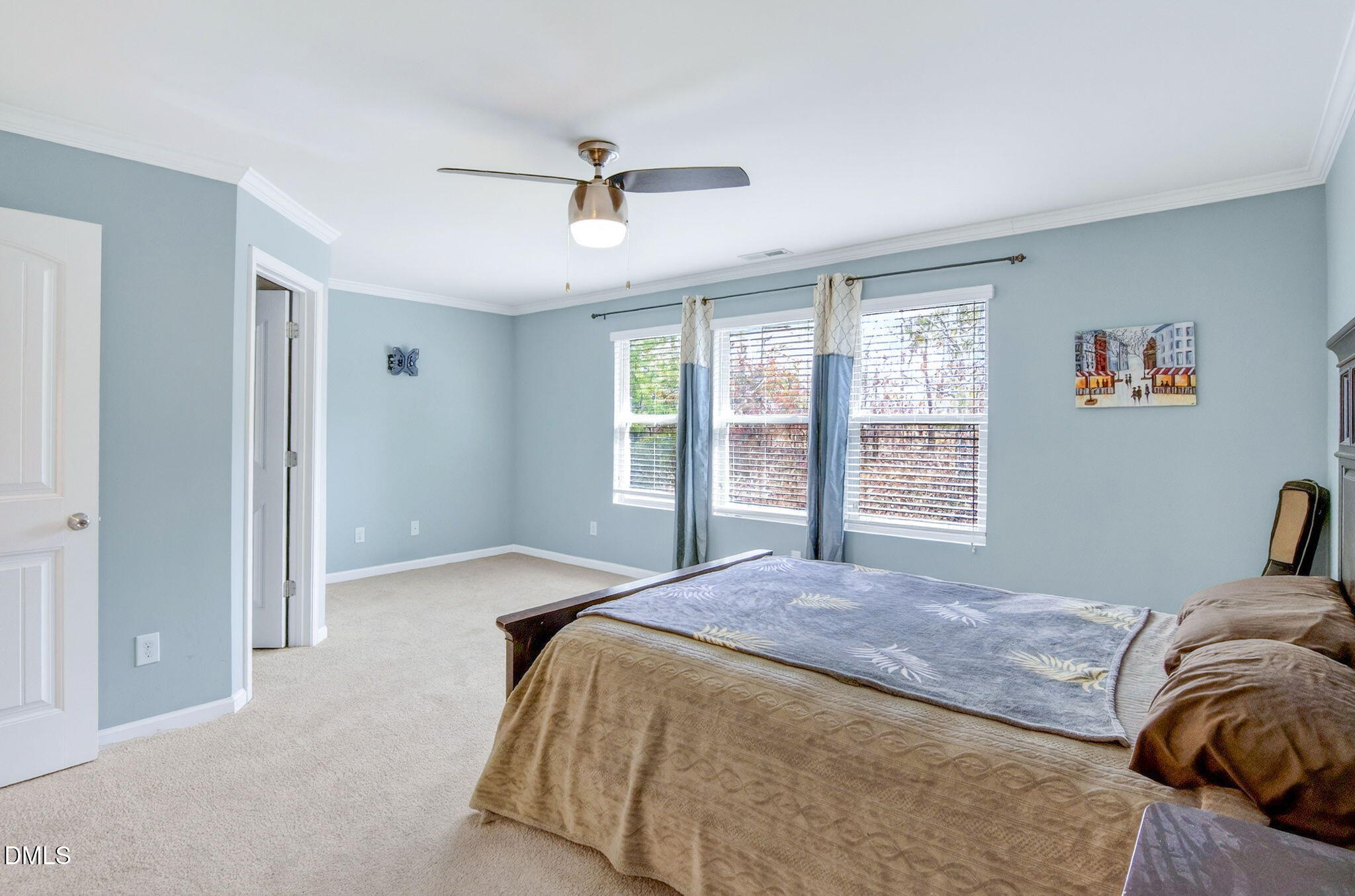 14310 Foxcroft Road Raleigh, NC 27614 - Photo 21 of 32 a bedroom with a large bed and a window