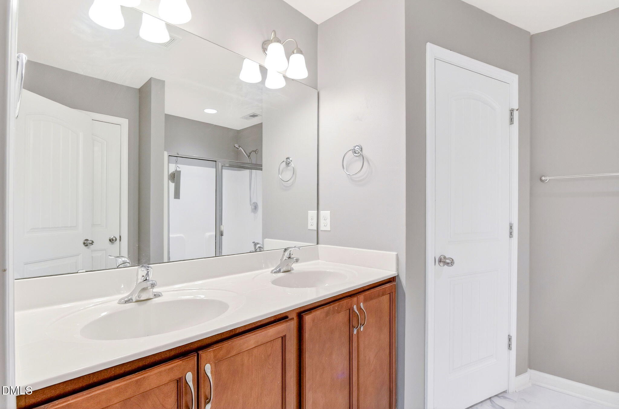 14310 Foxcroft Road Raleigh, NC 27614 - Photo 22 of 32 a bathroom with a sink double vanity and a mirror
