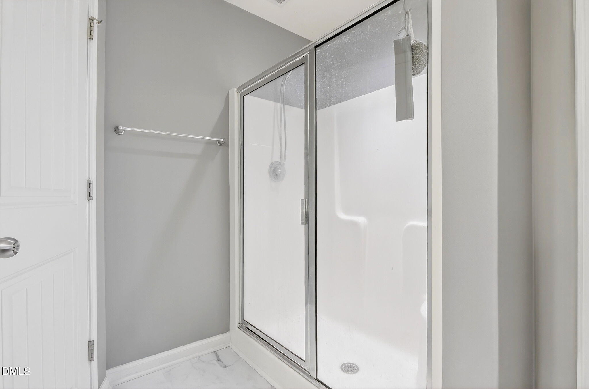 14310 Foxcroft Road Raleigh, NC 27614 - Photo 23 of 32 a bathroom with a glass shower door