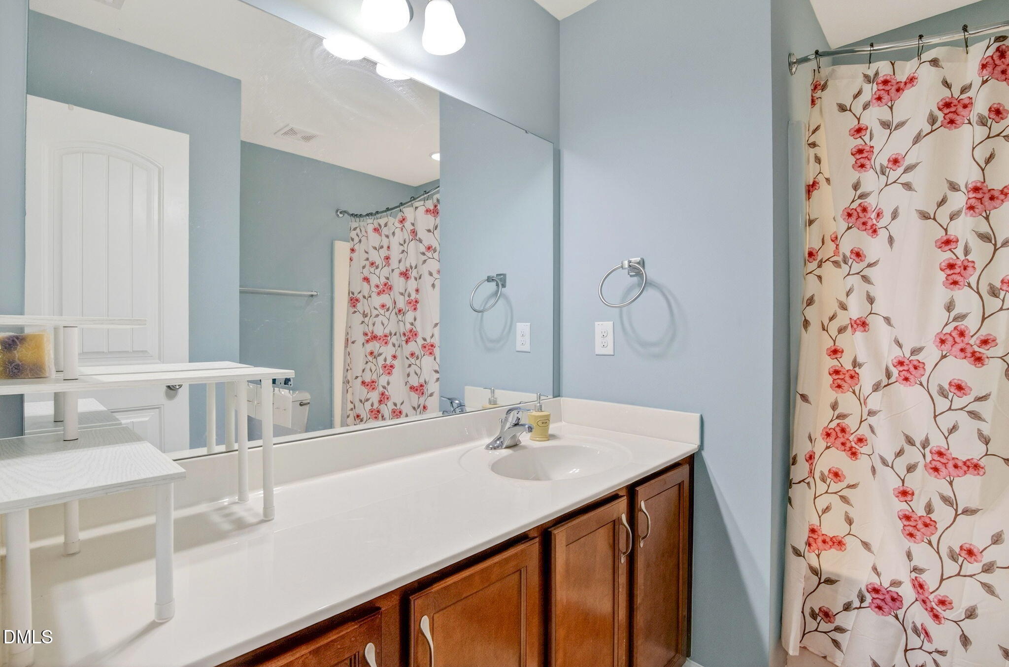 14310 Foxcroft Road Raleigh, NC 27614 - Photo 24 of 32 a bathroom with a sink and a mirror