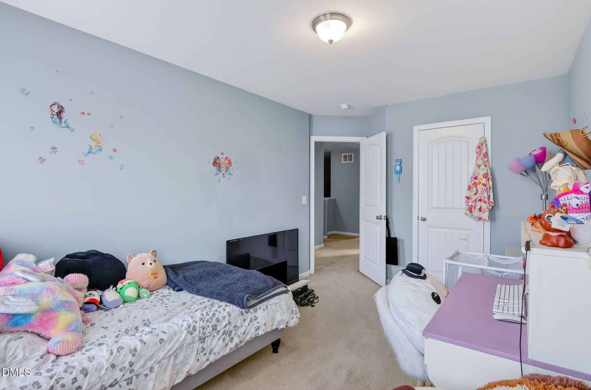 14310 Foxcroft Road Raleigh, NC 27614 - Photo 27 of 32 a bedroom with a bed and furniture