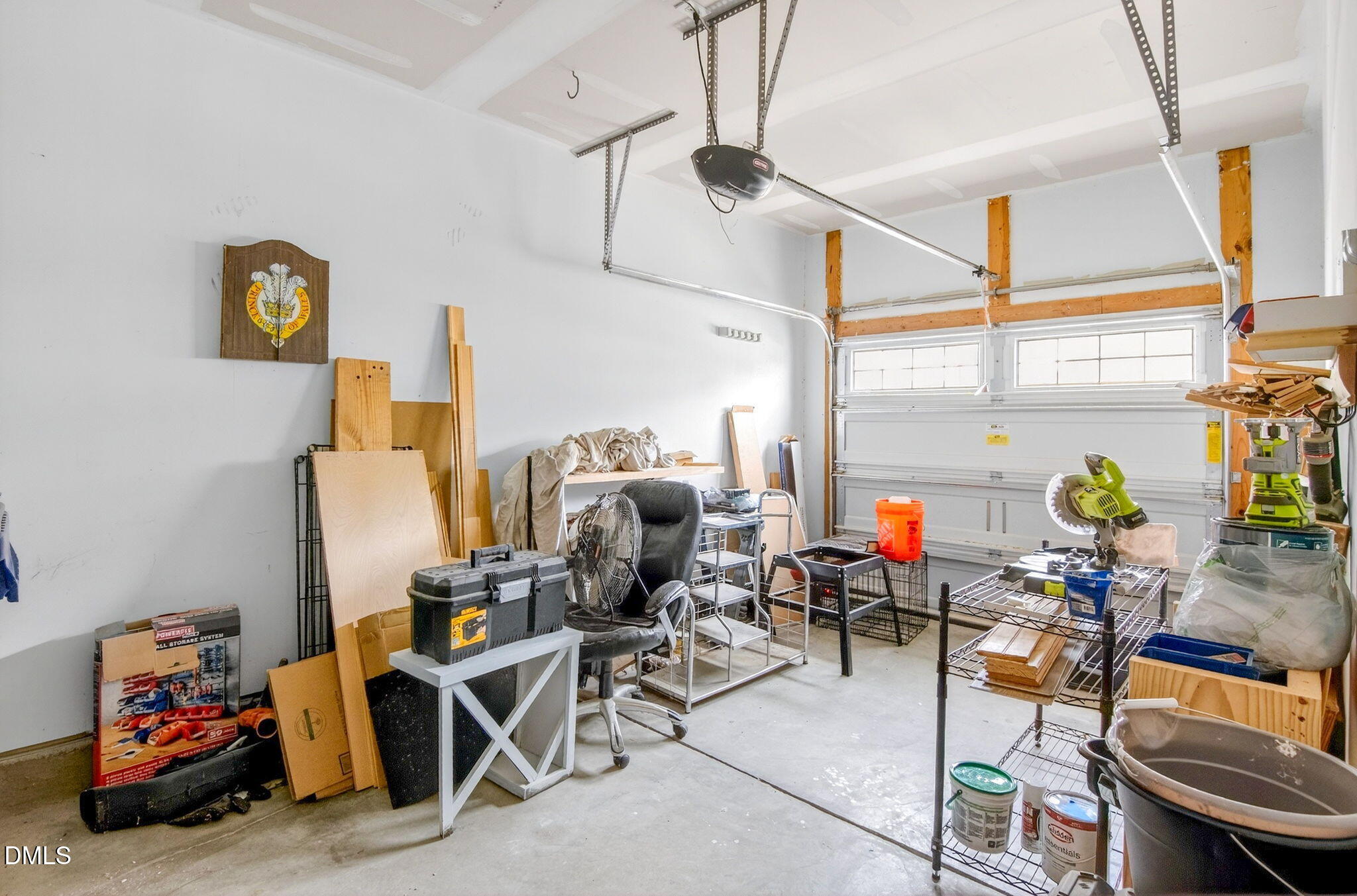 14310 Foxcroft Road Raleigh, NC 27614 - Photo 29 of 32 a living room with lots of furniture and a chandelier