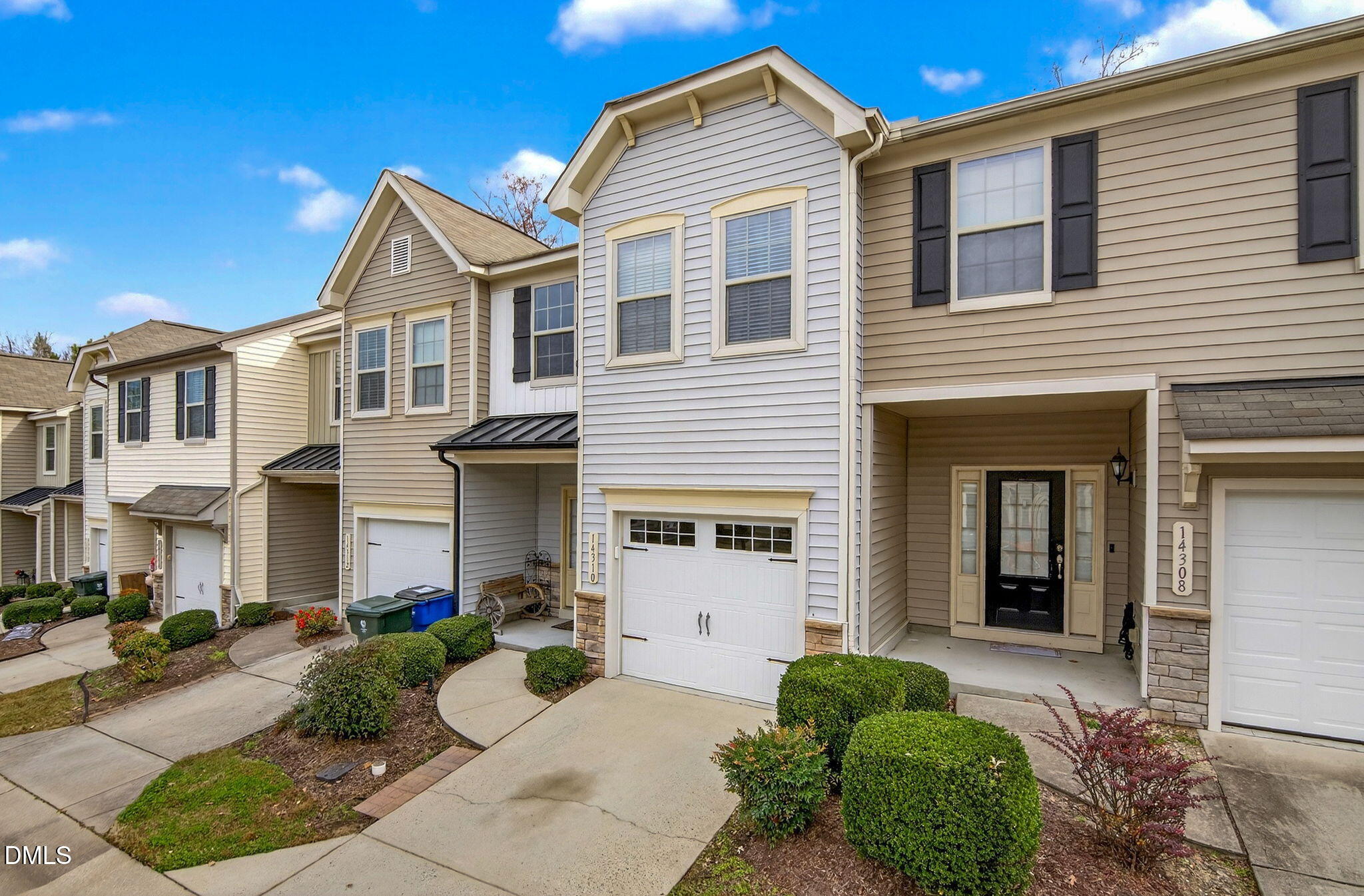 14310 Foxcroft Road Raleigh, NC 27614 - Photo 3 of 32 a front view of a house with garden