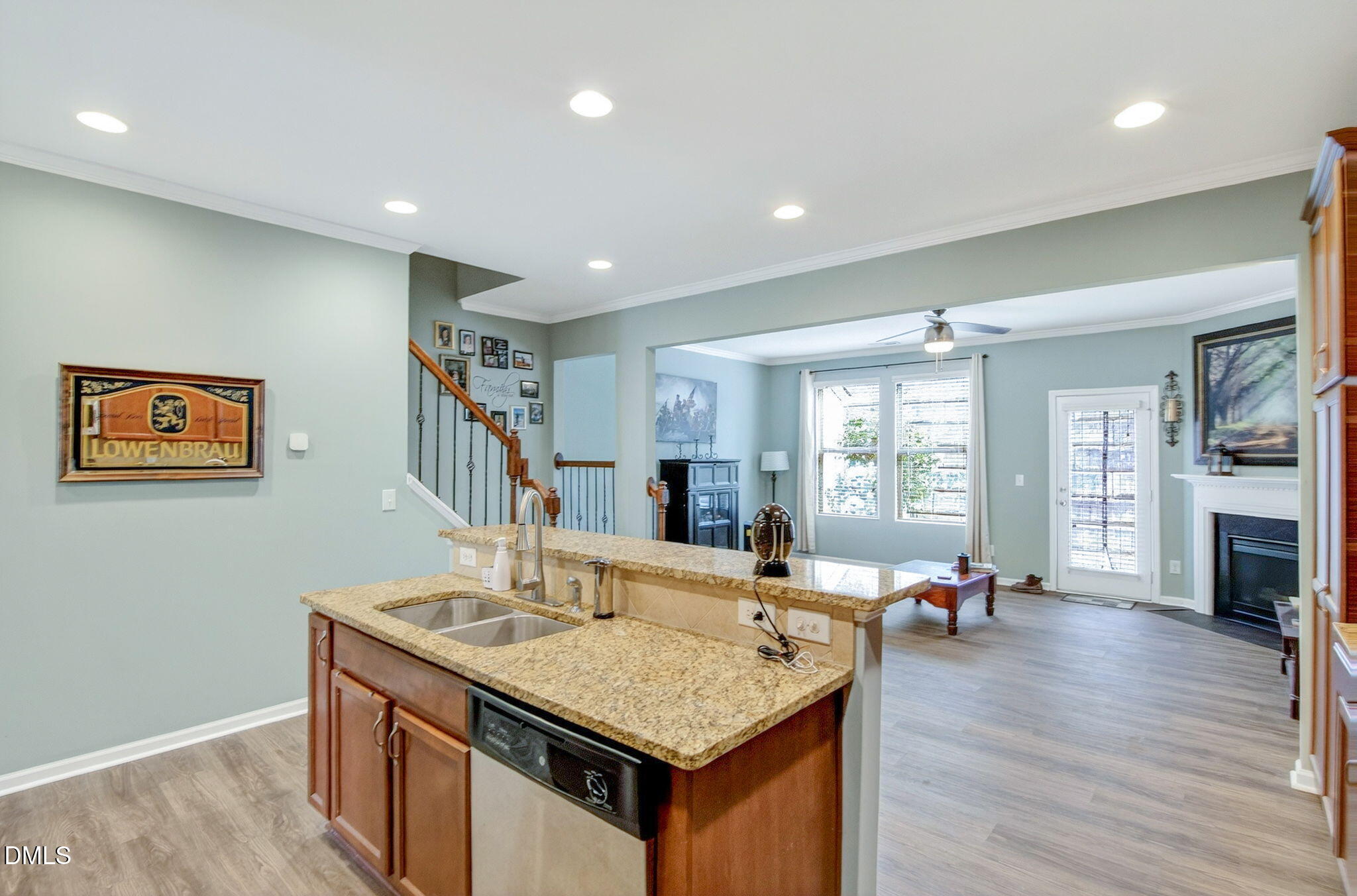 14310 Foxcroft Road Raleigh, NC 27614 - Photo 10 of 32 a kitchen with stainless steel appliances granite countertop a stove and a wooden floors
