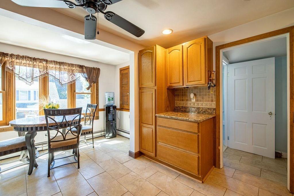 32 Maple Avenue Rutland, MA 01543 - Photo 12 of 42 a kitchen with a table chairs and refrigerator