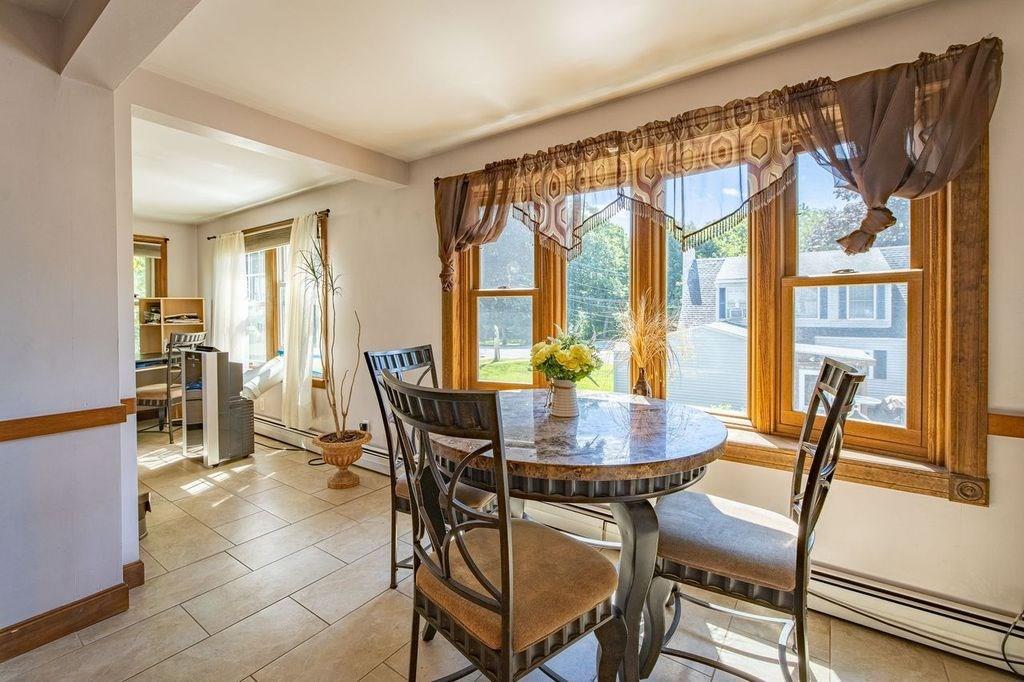 32 Maple Avenue Rutland, MA 01543 - Photo 13 of 42 a view of a dining room with furniture and a window