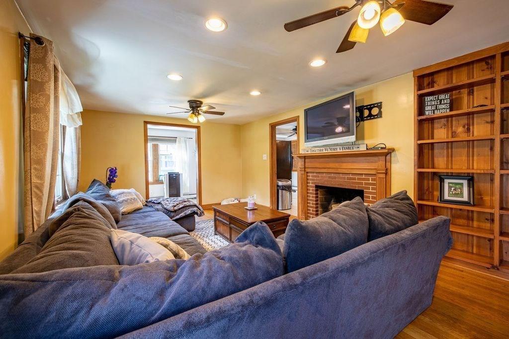32 Maple Avenue Rutland, MA 01543 - Photo 14 of 42 a living room with furniture a ceiling fan and a rug