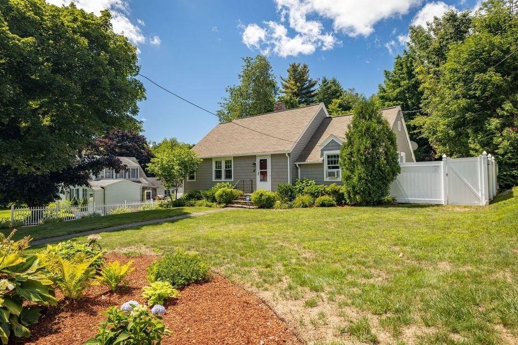 32 Maple Avenue Rutland, MA 01543 - Photo 2 of 42 a front view of a house with garden