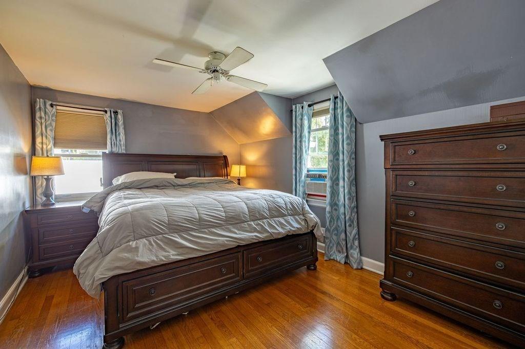 32 Maple Avenue Rutland, MA 01543 - Photo 21 of 42 a bedroom with a bed and wooden floor
