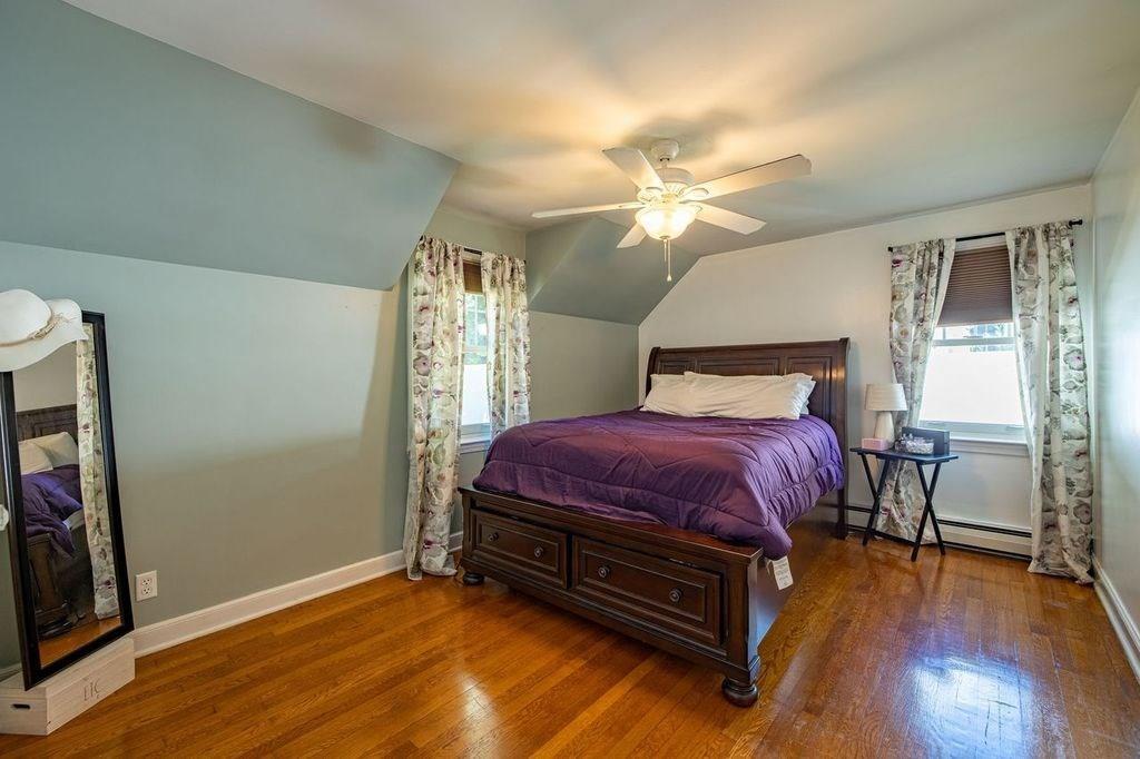 32 Maple Avenue Rutland, MA 01543 - Photo 23 of 42 a spacious bedroom with a bed dresser and a window