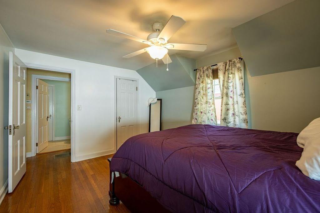 32 Maple Avenue Rutland, MA 01543 - Photo 24 of 42 a bedroom with a bed and a chandelier