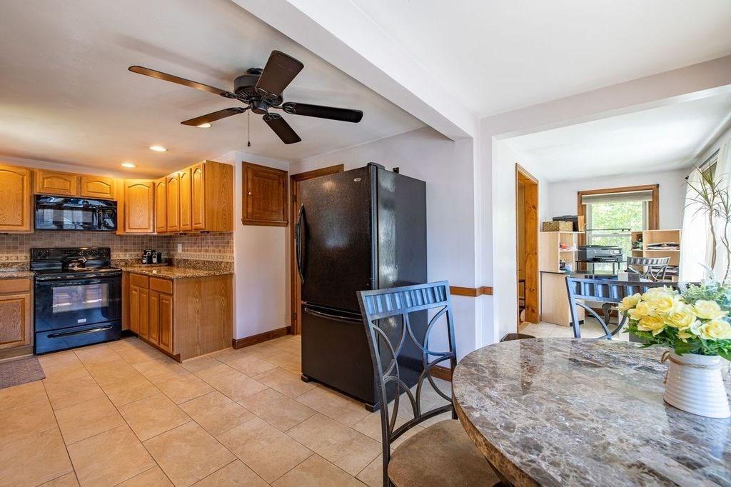 32 Maple Avenue Rutland, MA 01543 - Photo 9 of 42 a kitchen with stainless steel appliances granite countertop a refrigerator and a stove top oven