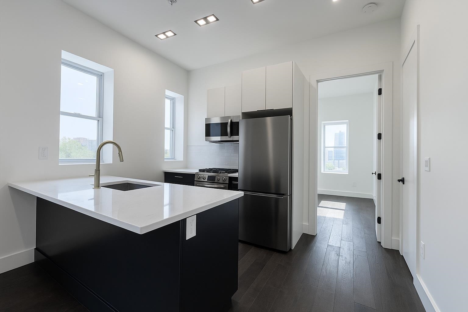 272 Hoboken Avenue, Unit 5 Jersey City, NJ 07306 - Photo 1 of 16 a kitchen with stainless steel appliances a refrigerator and a sink