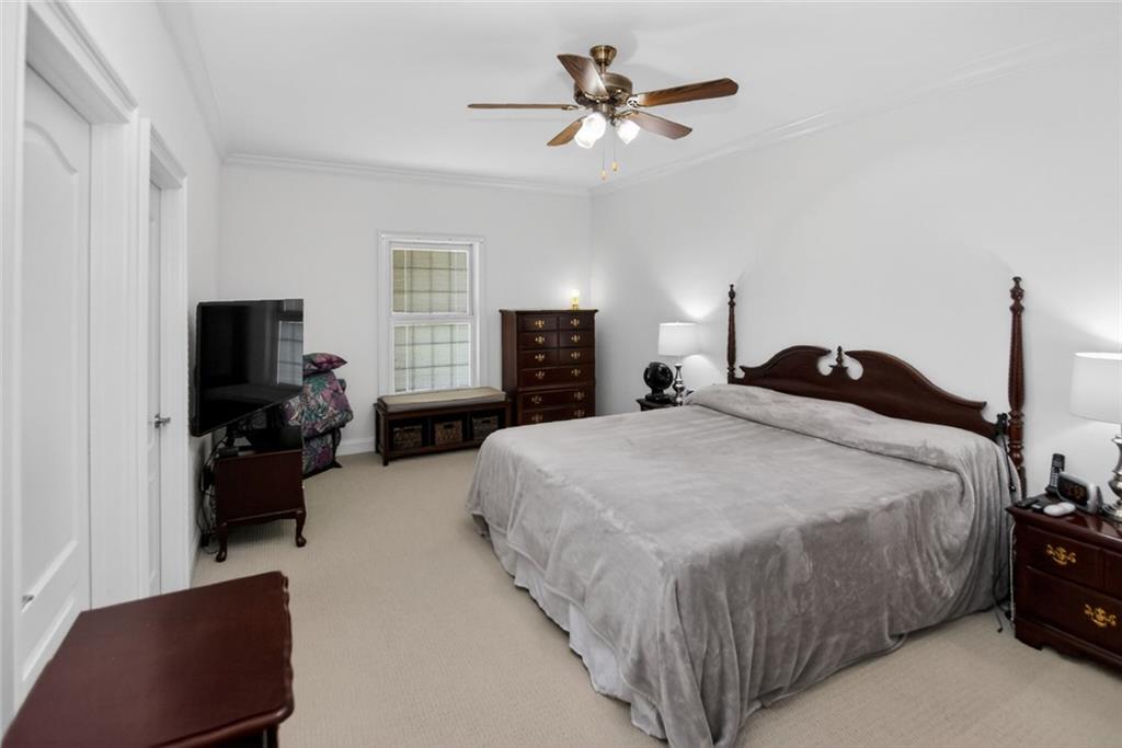 4113 Ledan Extension Gainesville, GA 30506 - Photo 106 of 195 a bedroom with a bed and a couch