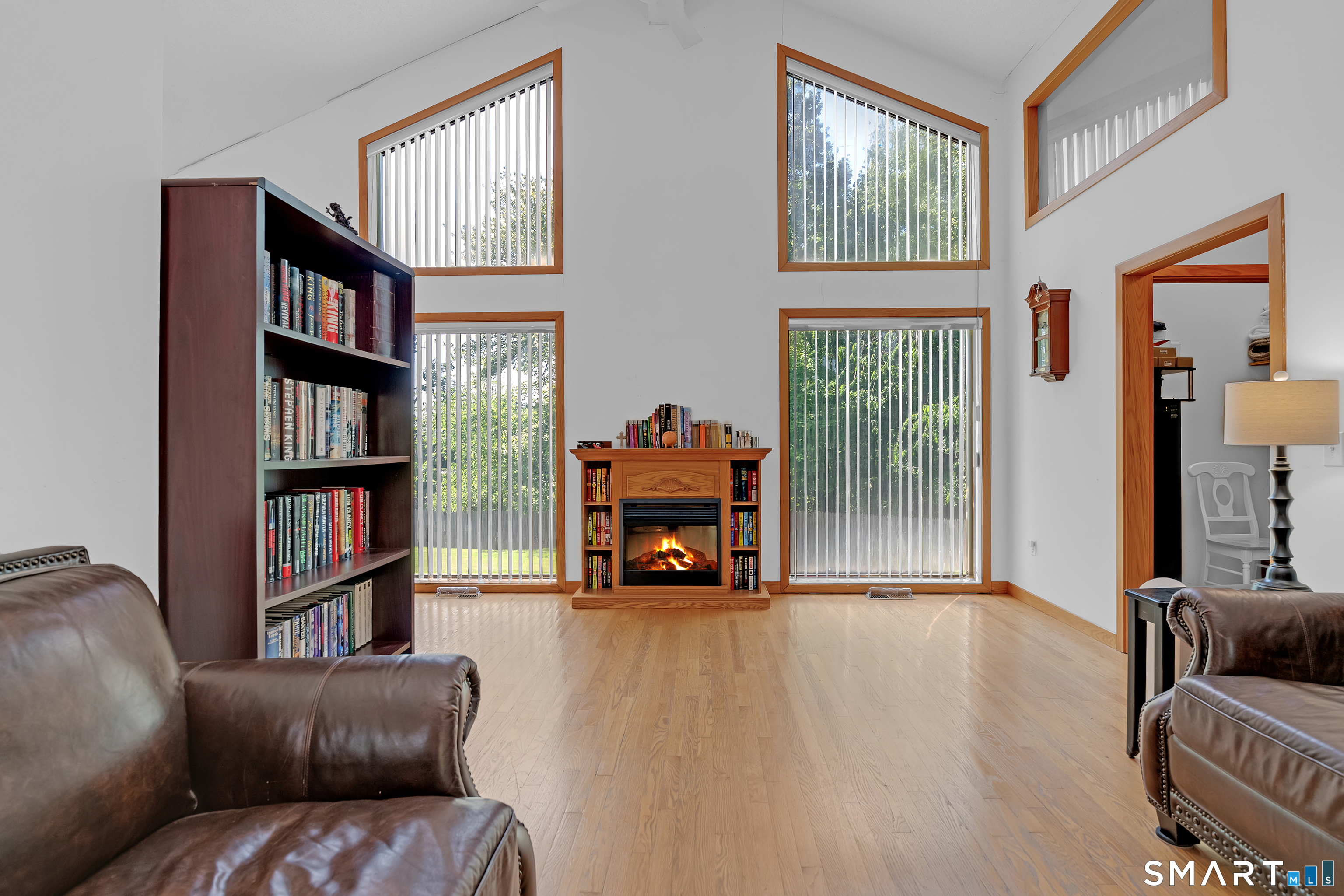90 Bell Street Manchester, CT 06040 - Photo 12 of 40 a living room with furniture and a floor to ceiling window