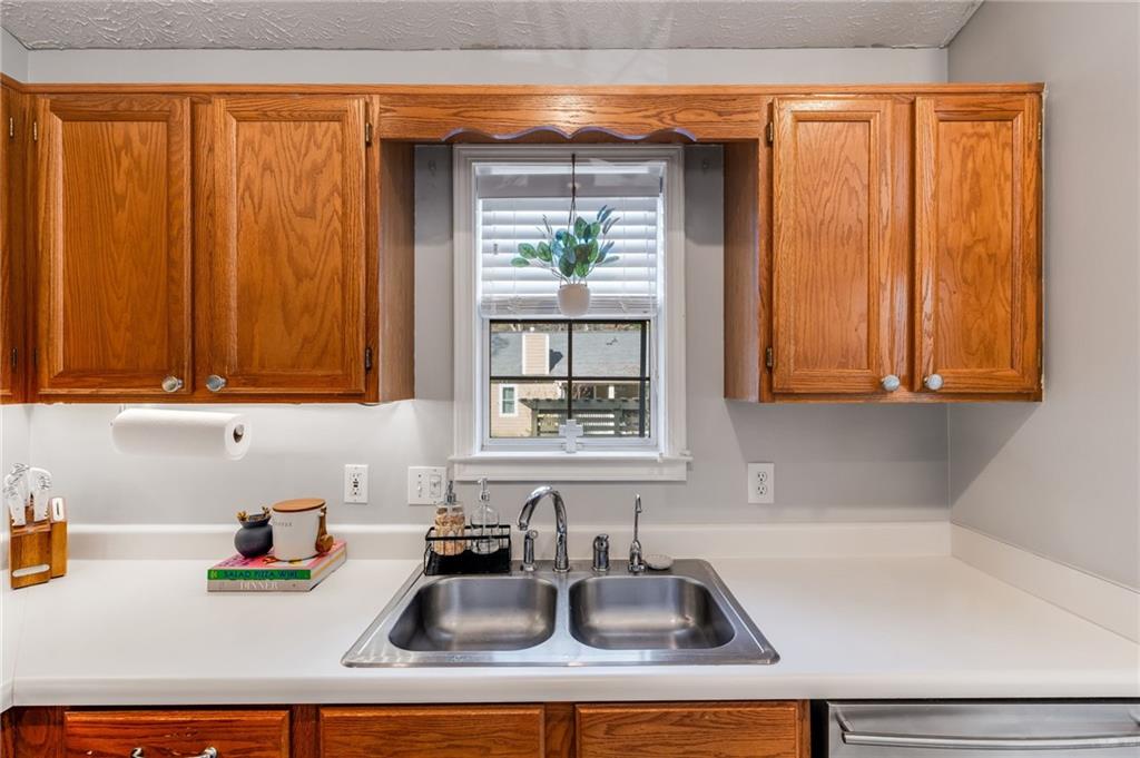384 Springbrooke Trail Dallas, GA 30157 - Photo 12 of 31 a kitchen with a sink cabinets and window
