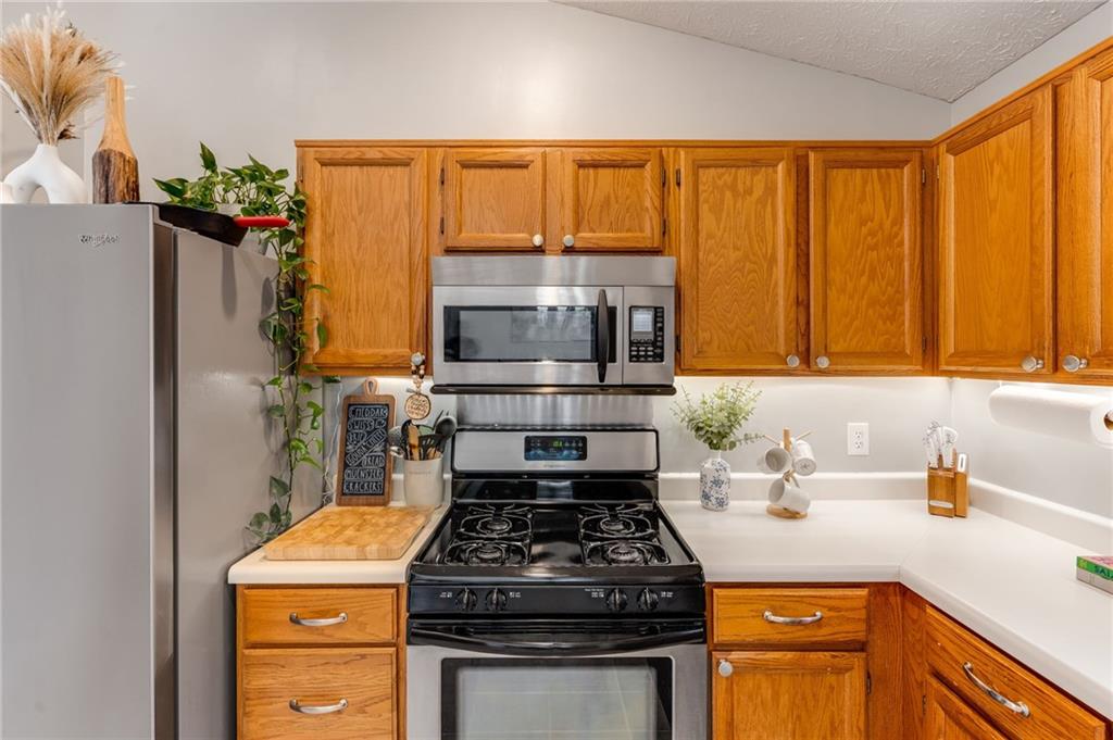 384 Springbrooke Trail Dallas, GA 30157 - Photo 13 of 31 a kitchen with a stove and a sink