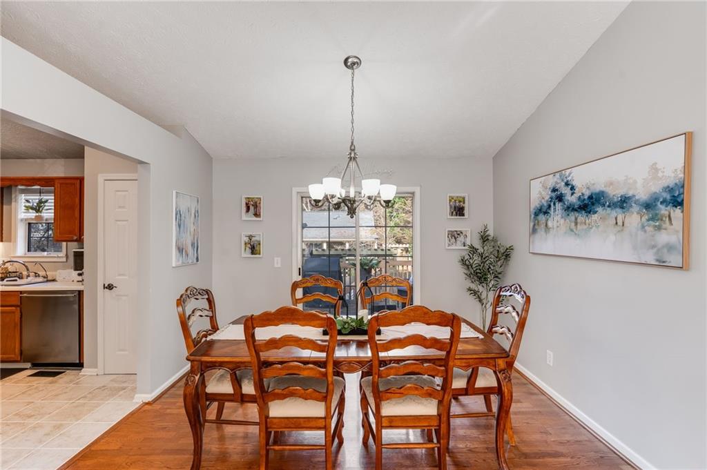 384 Springbrooke Trail Dallas, GA 30157 - Photo 15 of 31 a view of a dining room with furniture window and wooden floor