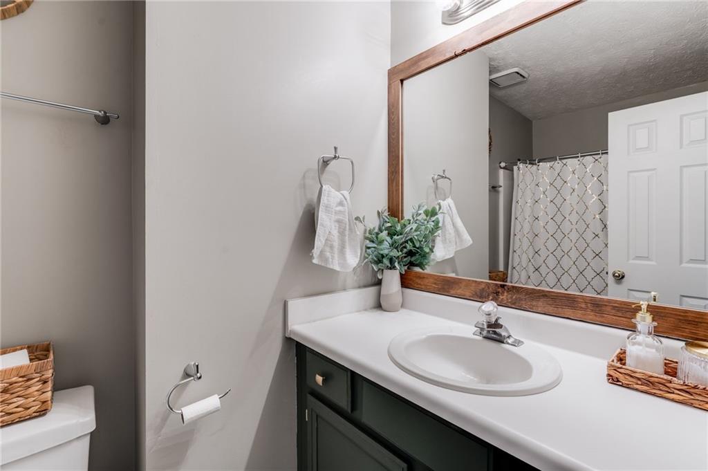 384 Springbrooke Trail Dallas, GA 30157 - Photo 16 of 31 a bathroom with a sink and a mirror