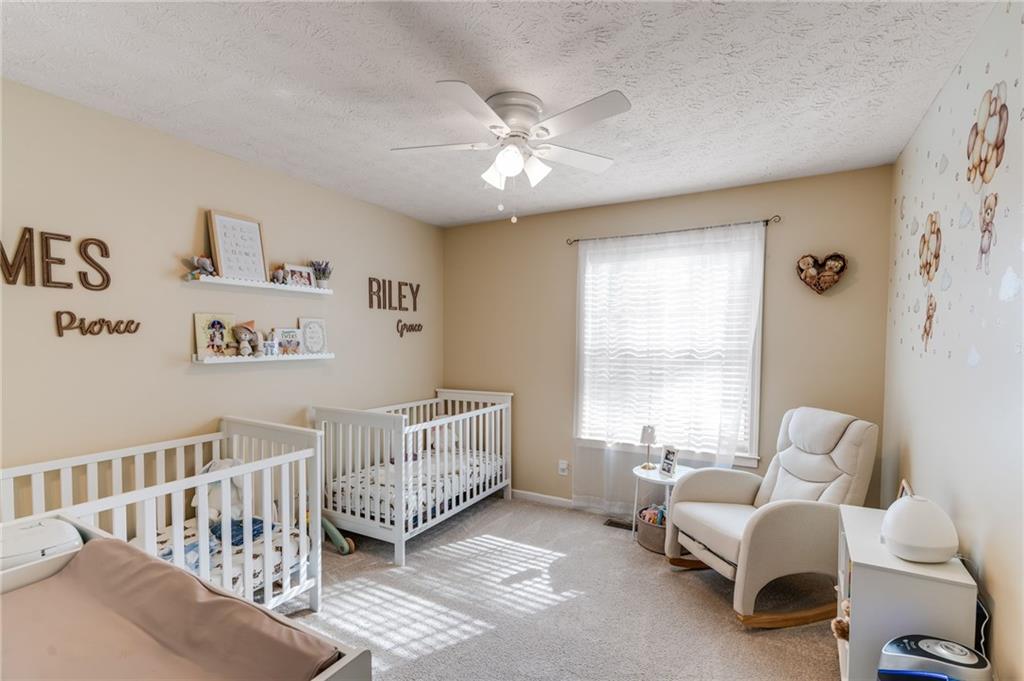 384 Springbrooke Trail Dallas, GA 30157 - Photo 17 of 31 a living room with furniture and a large window