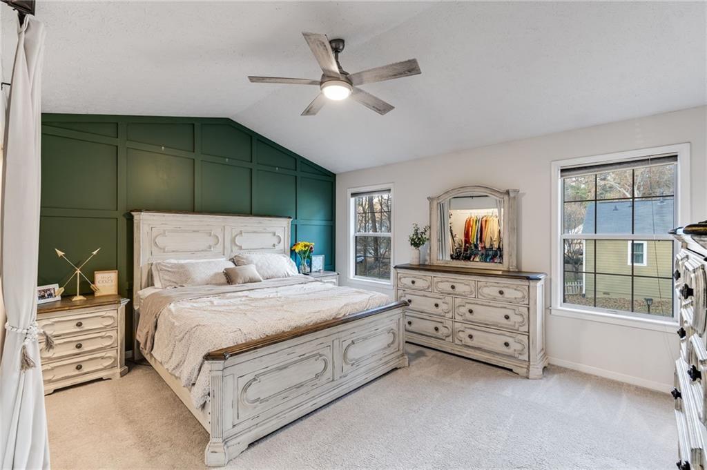 384 Springbrooke Trail Dallas, GA 30157 - Photo 19 of 31 a bedroom with a bed a window and mirror