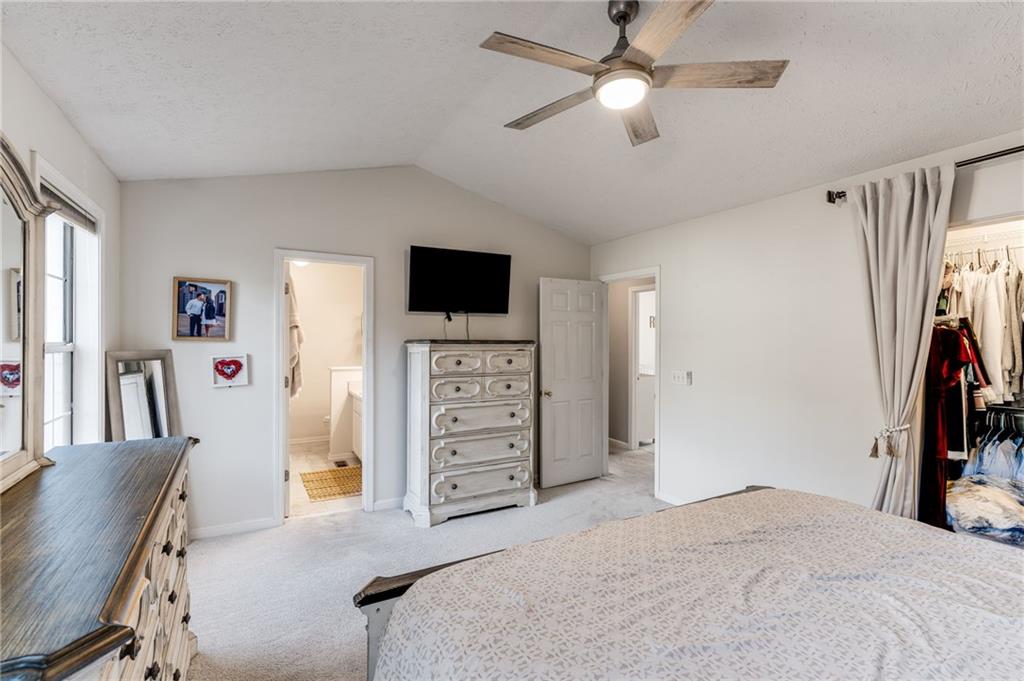 384 Springbrooke Trail Dallas, GA 30157 - Photo 20 of 31 a bedroom with a bed and a flat screen tv