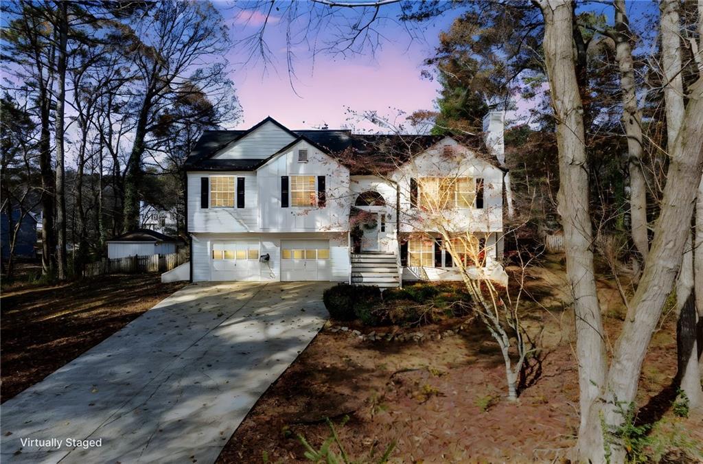 384 Springbrooke Trail Dallas, GA 30157 - Photo 2 of 31 a front view of a house with a yard