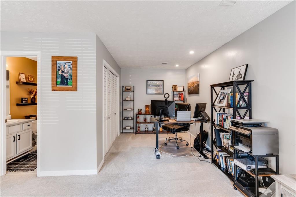384 Springbrooke Trail Dallas, GA 30157 - Photo 22 of 31 a view of a workspace with furniture and a window