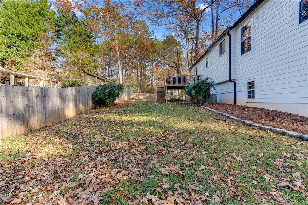 384 Springbrooke Trail Dallas, GA 30157 - Photo 29 of 31 a view of a backyard of the house