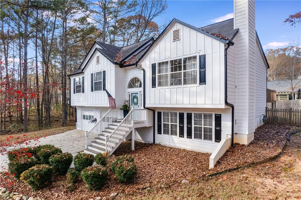 384 Springbrooke Trail Dallas, GA 30157 - Photo 4 of 31 a front view of a house with a yard and outdoor seating