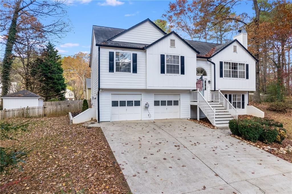 384 Springbrooke Trail Dallas, GA 30157 - Photo 5 of 31 a view of a house with a yard and large tree