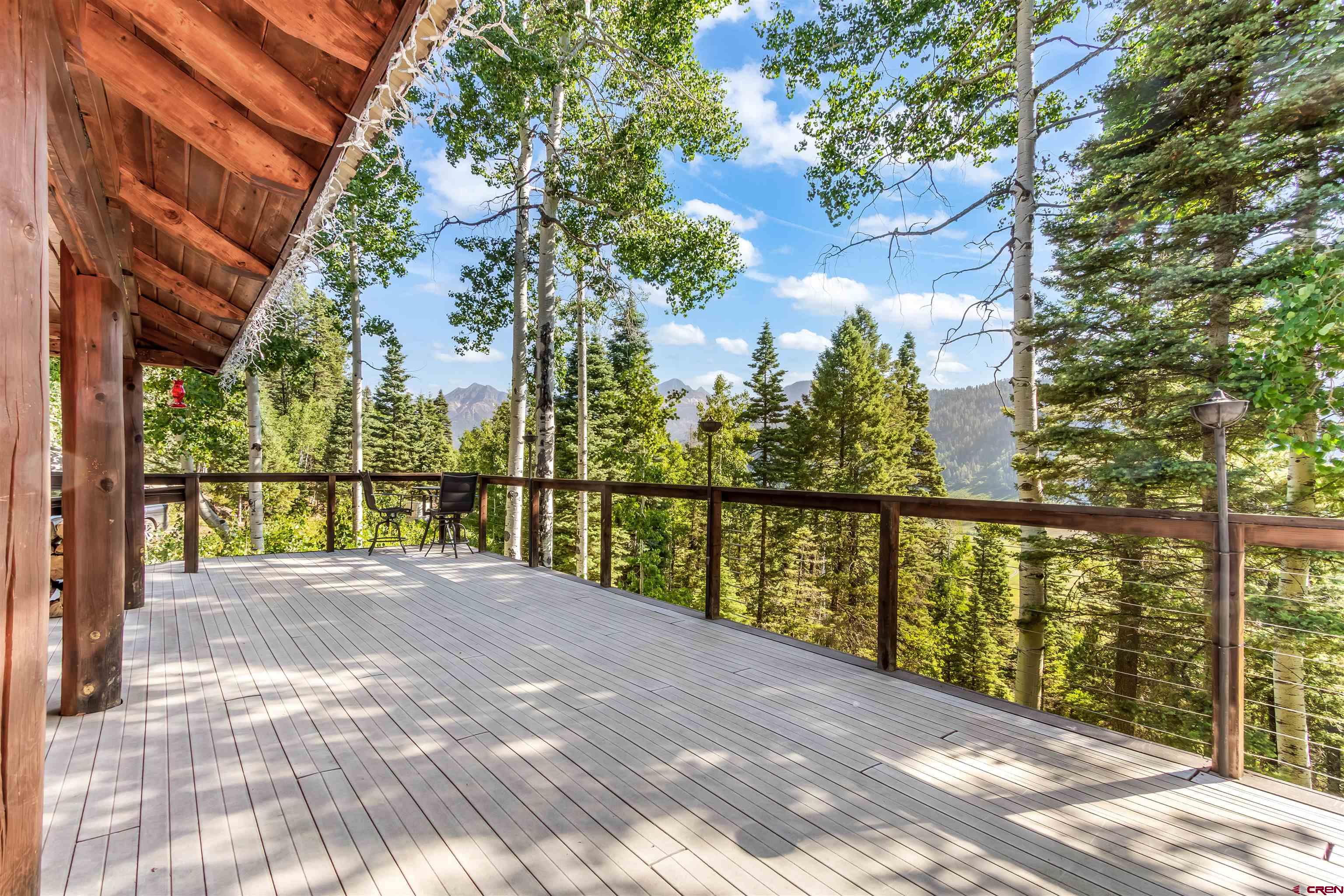 504 Weminuche Road Pagosa Springs, CO 81147 - Photo 21 of 44 a view of balcony with floor to ceiling windows and wooden fence