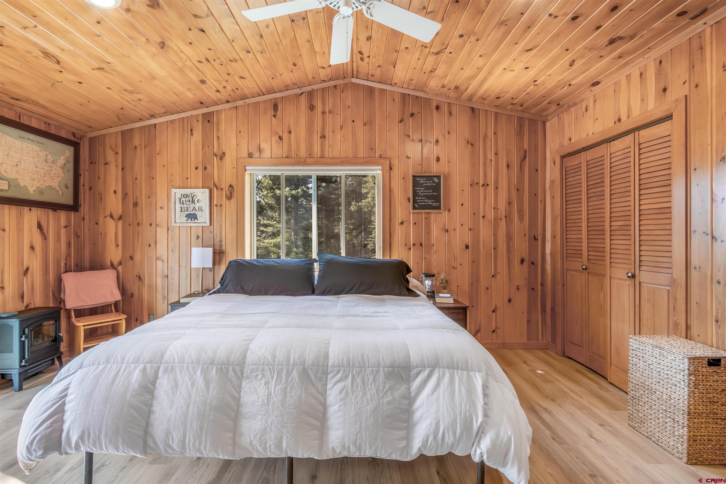 504 Weminuche Road Pagosa Springs, CO 81147 - Photo 39 of 44 a large bed sitting in a spacious bedroom next to a window