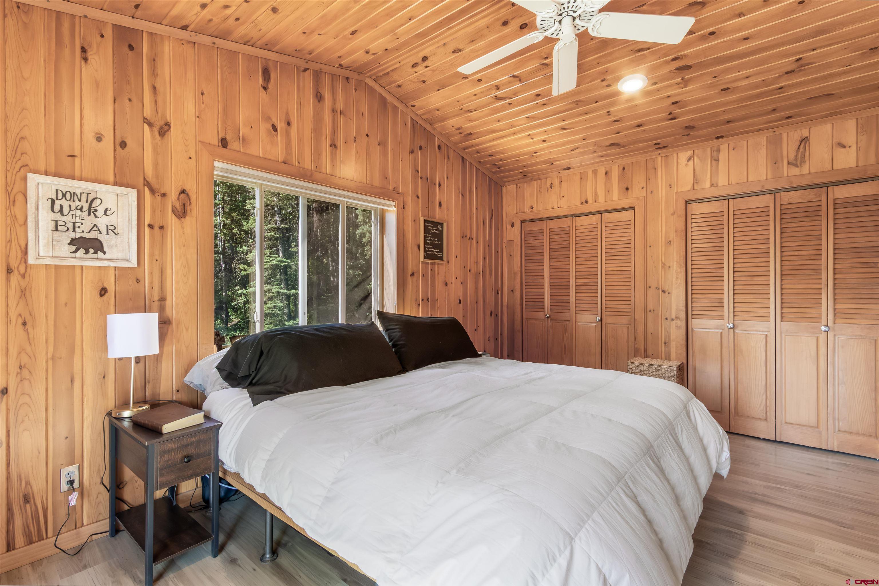 504 Weminuche Road Pagosa Springs, CO 81147 - Photo 41 of 44 a large bed sitting in a bedroom next to a window