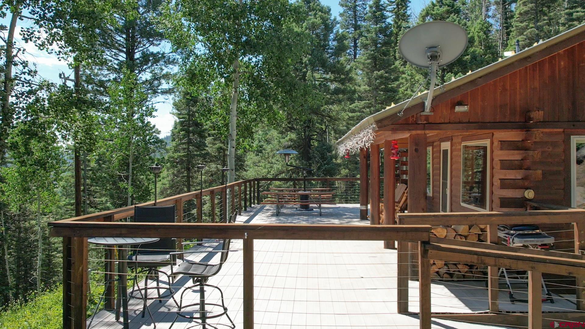 504 Weminuche Road Pagosa Springs, CO 81147 - Photo 9 of 44 a view of house with roof deck and furniture